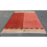 A Turkish made contemporary design pinky red two tone wool carpet, 270cm x 220cm approx.