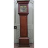 A Georgian oak longcase clock with column supports enclosing a square brass dial with cast