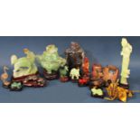 A collection of oriental agate and glass jadeite groups including frogs, crane, sensor and cover,