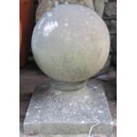 A weathered cast composition stone sphere pier cap/finial, 22 cm diameter approximately
