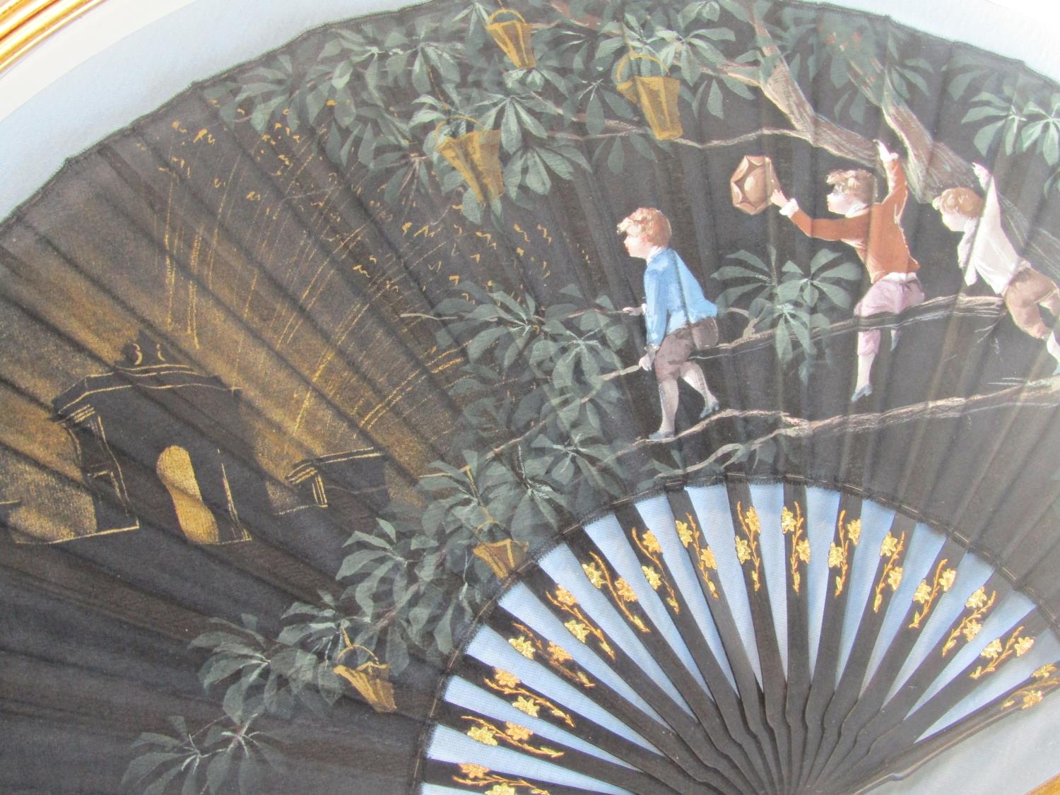 A late 19th century French fan on satin with ebony sticks, with painted detail showing three boys at - Image 3 of 3