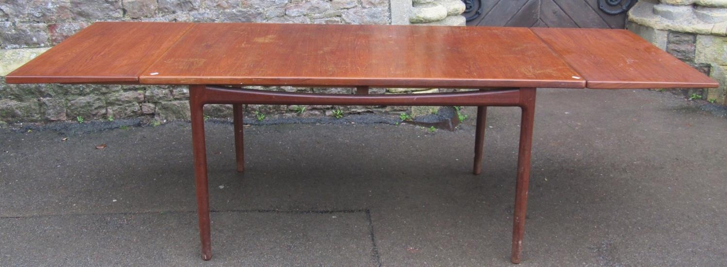 A G plan teak dining table of rectangular form designed by Covid Larson with two pull out and