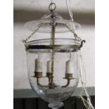 A good quality hanging crystal pendant light of cylindrical and slightly tapered form, circular