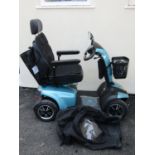 A Careco Corvus Rapide mobility scooter in a turquoise colourway with eight mph capacity complete