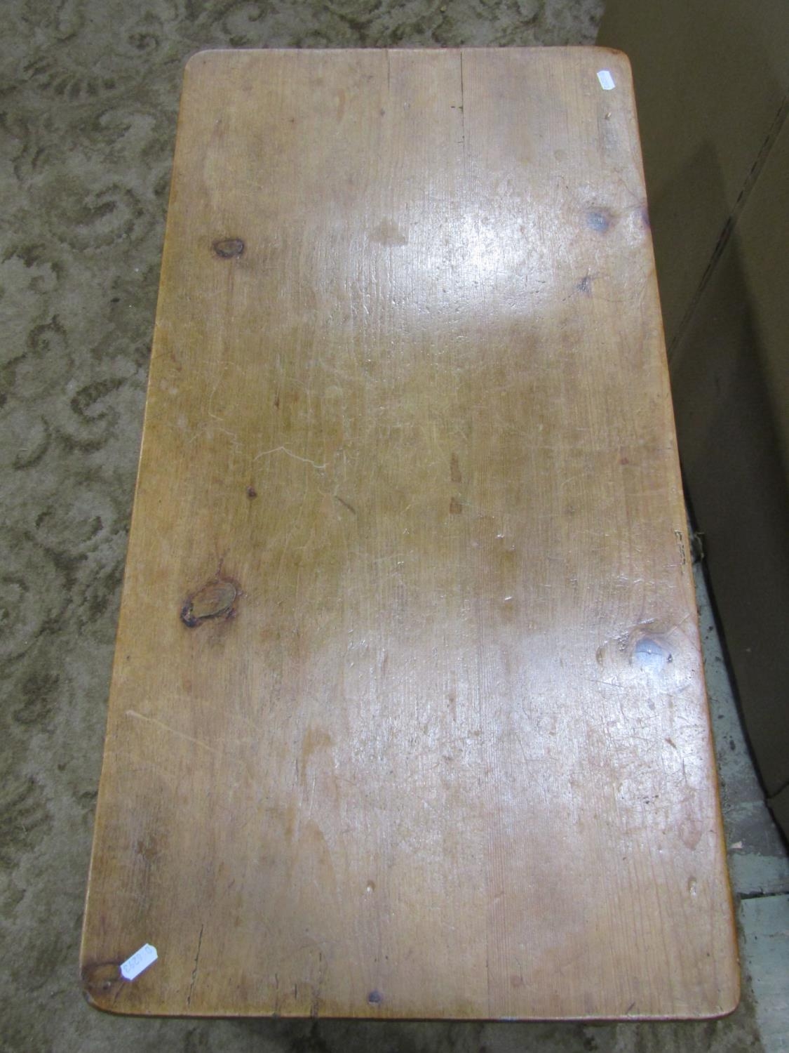 A stripped pine occasional table of rectangular form raised on turned supports, 91 cm long x 44 cm - Image 2 of 4