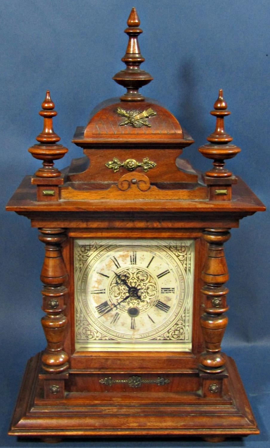 Late 19th century walnut mantle clock, the case of architectural form with turned spindle