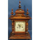 Late 19th century walnut mantle clock, the case of architectural form with turned spindle