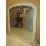 A 19th century over mantle mirror with later overpainted gilt moulded arched frame 114cm wide x