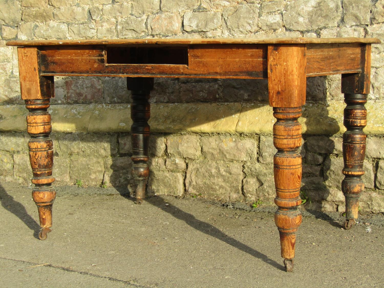 A late Victorian scrubbed pine kitchen table raised on turned supports (lacks frieze drawer, AF) 4ft - Image 3 of 3