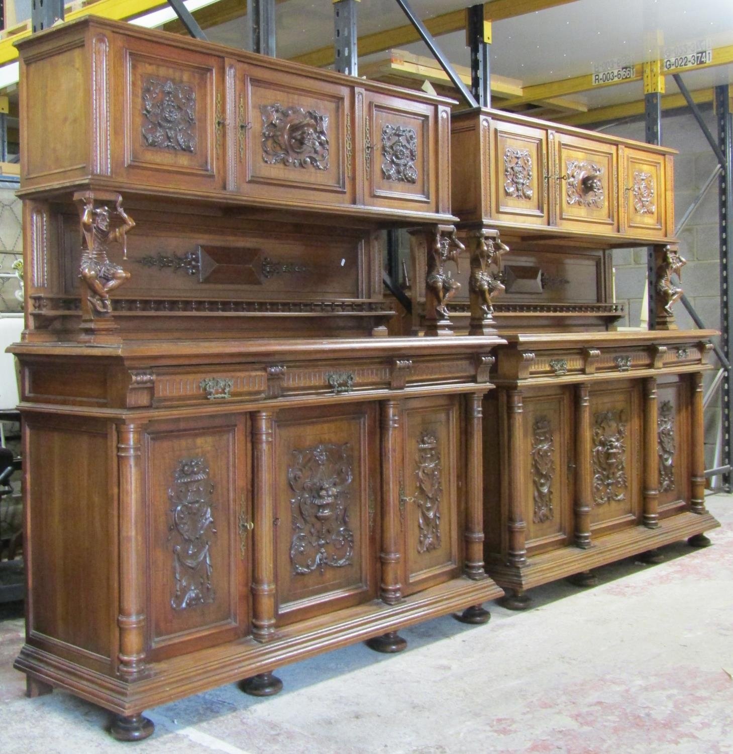 A pair of 19th century walnut buffets of good quality, the lower section enclosed by three