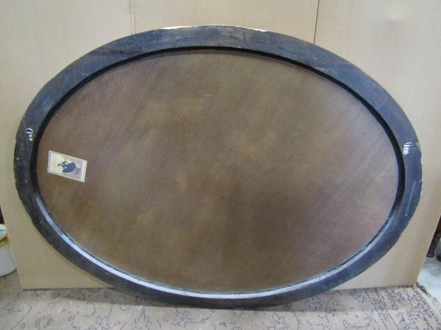 A large oval antique style wall mirror with bevelled edge plate within a scrolled and simulated - Image 3 of 4