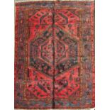 A North West Persian Zanjan Rug, with a central medallion of stylised flowers on a pink ground,192cm