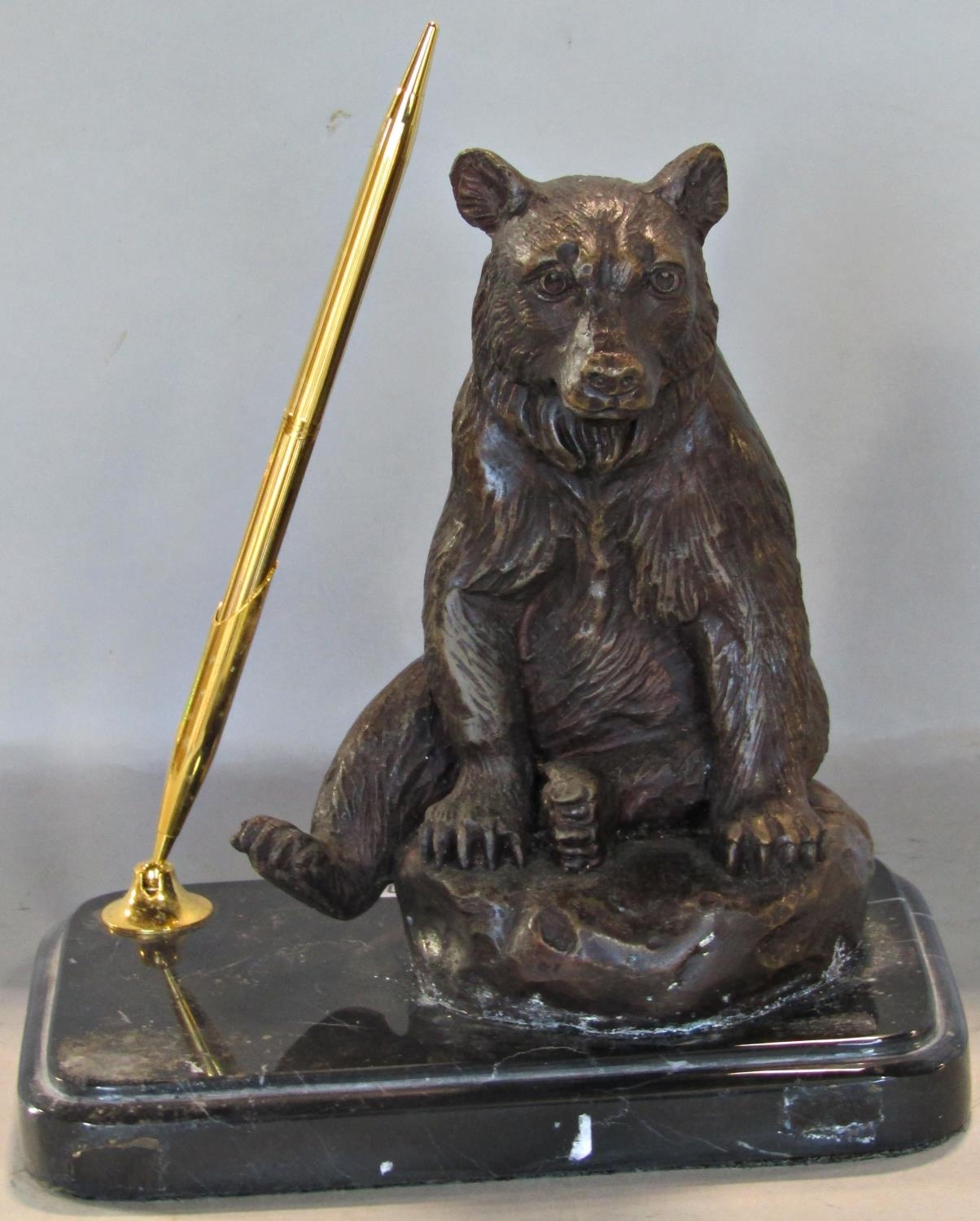 A pen stand, the marble base surmounted by a bronzed figure of a bear
