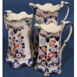 A large collection of blue and white transfer ware and relief moulded jugs, some with pewter covers,