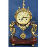 A contemporary mantle clock, the movement held aloft by two cherubs, with painted dial - Charles
