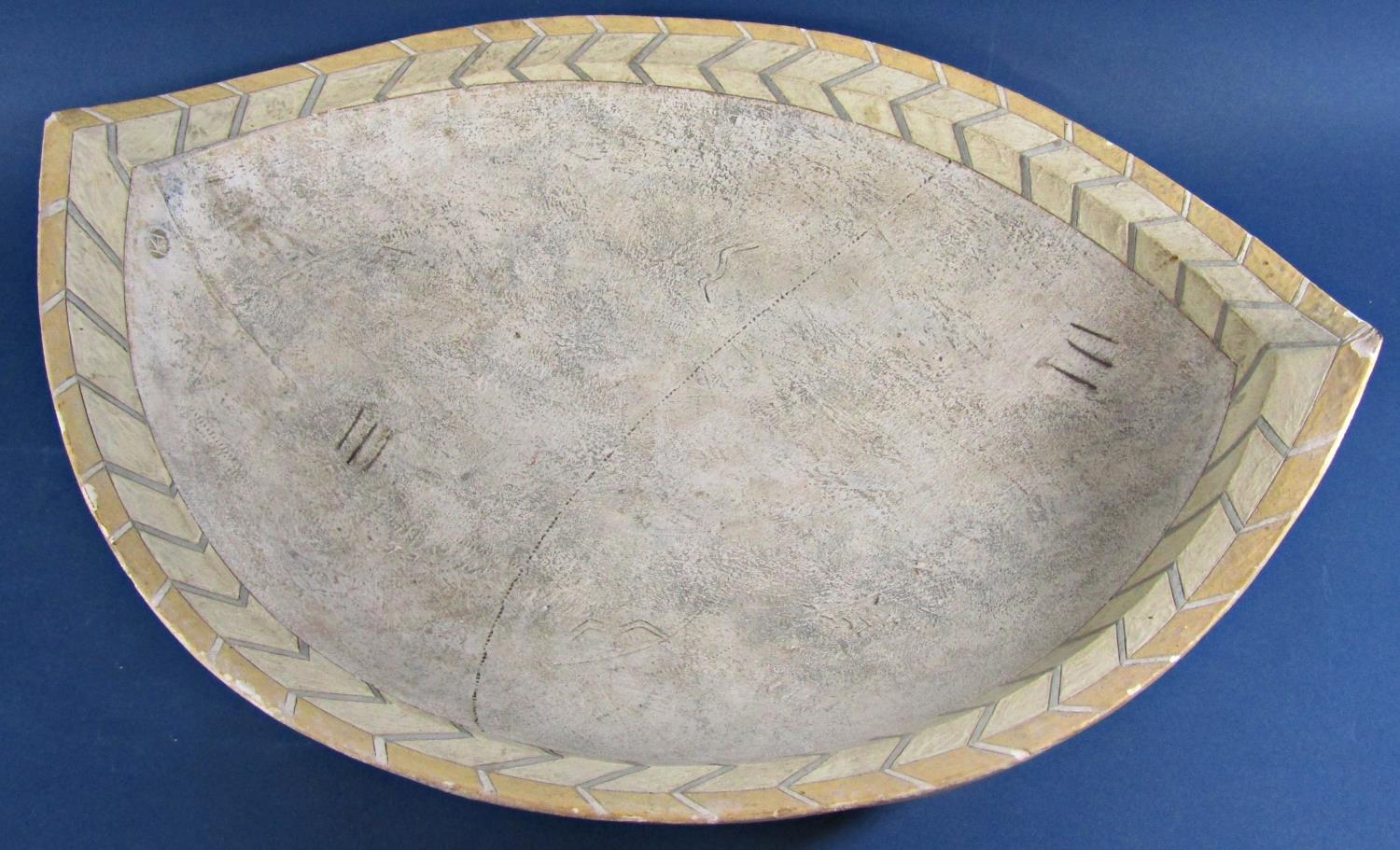 A large ovoid shaped studio pottery dish set within two herring bone bands and central panel with