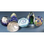 A collection of sixteen modern paperweights, including a pair of apples, a purple heart all signed G