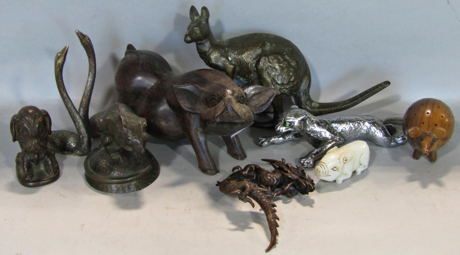 A collection of bronze figures to include Kangaroo, humorous dog, dormouse, Chinese Dragon, together