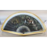 A late 19th century French fan on satin with ebony sticks, with painted detail showing three boys at