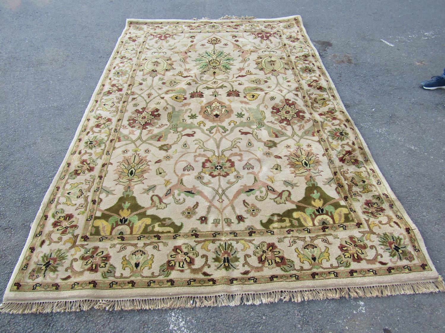 A Kashan , Ziegler type, carpet with an all over floral design on a cream ground, 300cm x 200cm