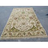 A Kashan , Ziegler type, carpet with an all over floral design on a cream ground, 300cm x 200cm