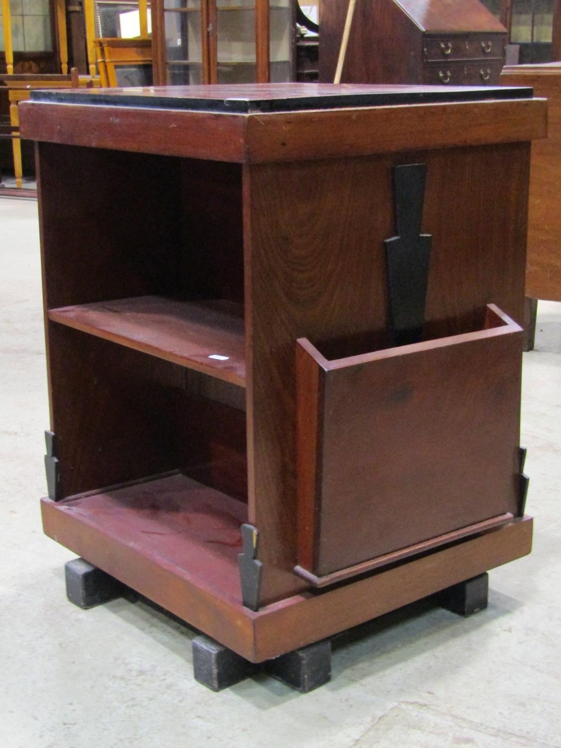 An Art Deco style mahogany revolving bookcase of square cut form with ebonised detail, 60 cm