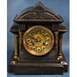 A small Victorian black slate and brass mantle clock, the case of architectural form, enclosing an