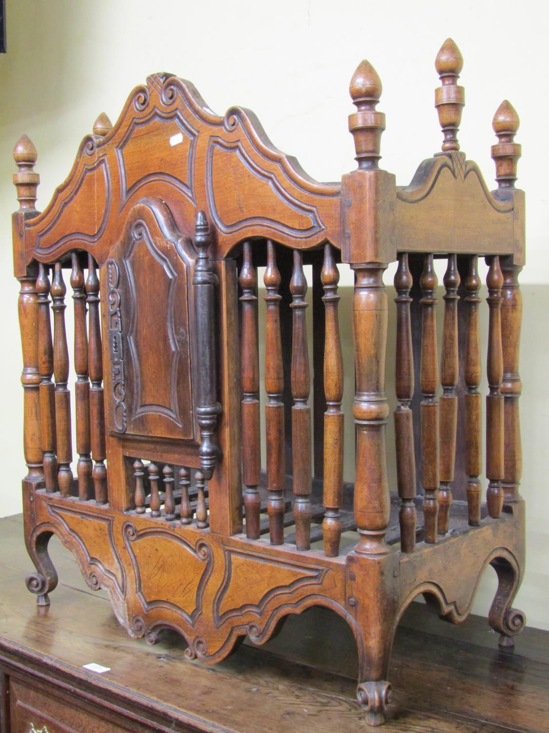 A late 18th century walnut food or dole cupboard, the central door with sturdy hinge and lock plate,