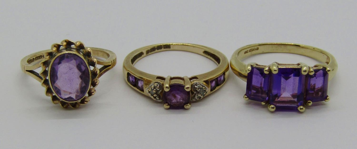 Three 9ct amethyst rings to include a diamond set example, 7.1g total (3)