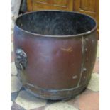 A vintage copper coal/log bin with pop riveted band, lions mask and ring handles (af), approx 40