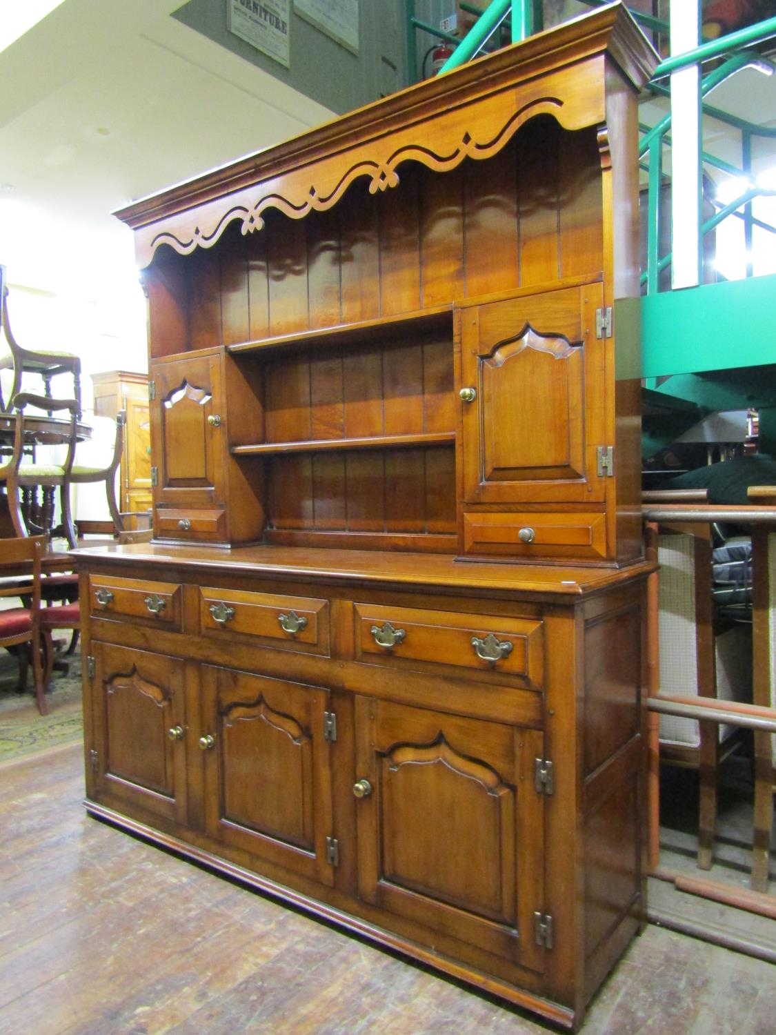 A good quality contemporary dresser and plate rack in an 18th century style, the base enclosed by