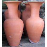 Four (two pairs) of contemporary terracotta vases (varying design), 50 cm high approximately