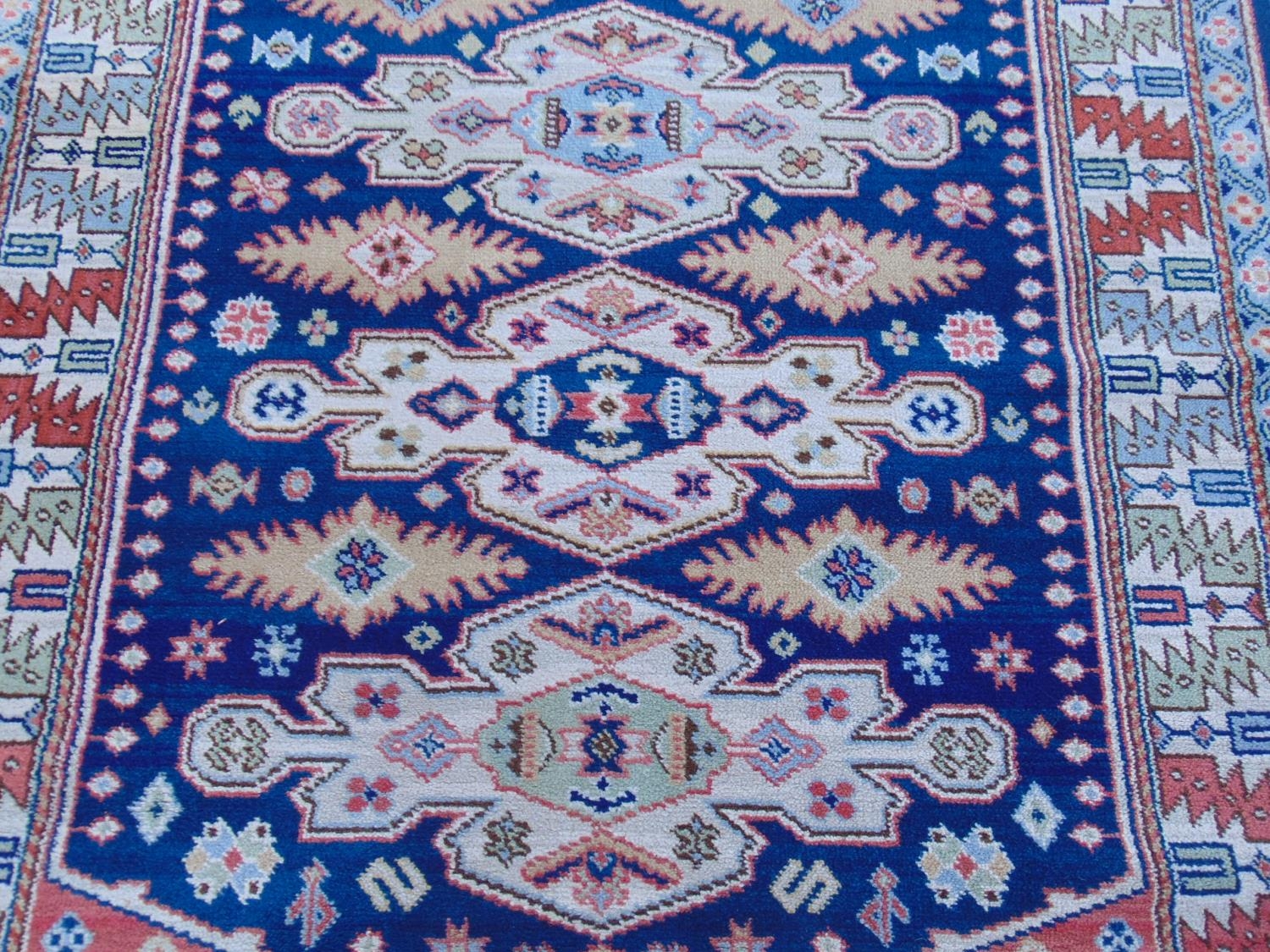 A Kazak design rug with four stepped medallions and geometric borders, 200 mx 140 cm approximately - Image 2 of 3