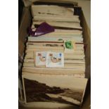 A box of miscellaneous stamps, many from torn envelopes, mainly mid-20th century and later, a