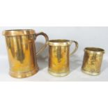 Three 19th century graduated brass tankards , a Quart, a Pint and a Half Pint.