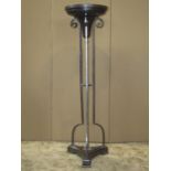 A good quality contemporary heavy gauge jardiniere stand with circular leather clad top raised on