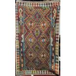 A Chobi Kilim with a tight repeating multi coloured diamond design 213cm x 126cm approx.