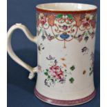 An 18th century Chinese porcelain tankard in the European manner with scrolled handle and hand