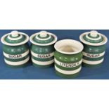 Four cloverleaf green and white banded storage jars, together with three Ironbridge tiles in an