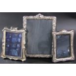 Three late 20th century silver photo frames, 20 x 15 cm opening, 15.5 cm opening and 13 cm x 8 cm