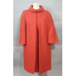 Vintage clothing; a 1960's outfit in coral wool by Peggy French Couture comprising short sleeved