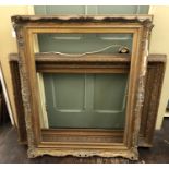 Two Victorian Gilt Wood and Gesso Frames with laurel leaf details (84 x 122 cm) and scrolling Rococo