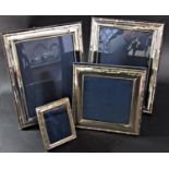 Four near matching silver photo frames by various makers, 2 x 20 x 14 cm opening, one at 12 x 12