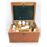 A mahogany Homeopathic Chemist Box, W B Smith & Son Gosport, containing bottles of natural medicines