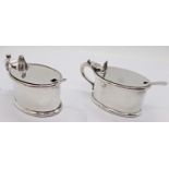 Pair of 19th century gold plated lunettes and two silver plated mustard pots of oval form, both with