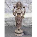 A hollow cast bronze Hindi goddess Lakshmi with four arms standing on a lotus base, 82cm high