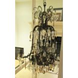 A good quality early 20th century cast brass chandelier burning six electric bulbs, the outer rim