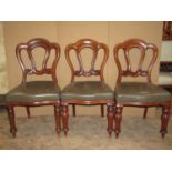 A Harlequin set of six similar Victorian walnut balloon back dining chairs with moulded frames,