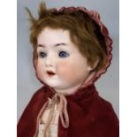 3 dolls: an early 20th century bisque head German character doll by Ernst Heubach with jointed