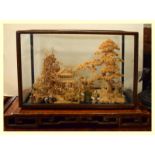 An early 20th century Chinese Cork Diorama of pagodas amongst park land, in a polished lacquered